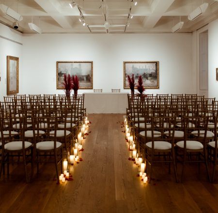 Wedding set up in gallery 16 detailing chairs and lights in the aisle