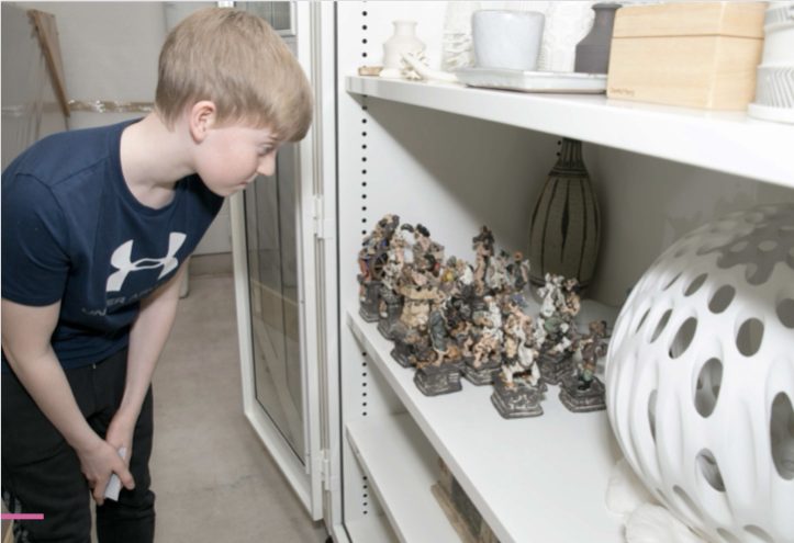 Child looking at sculpture